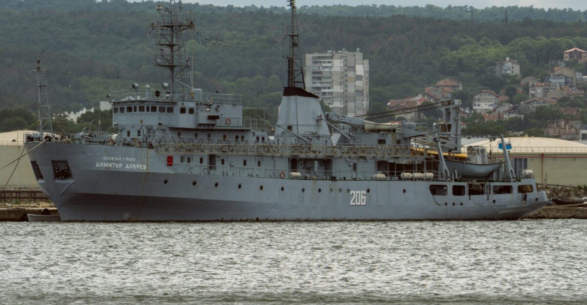a large gray ship in a body of water