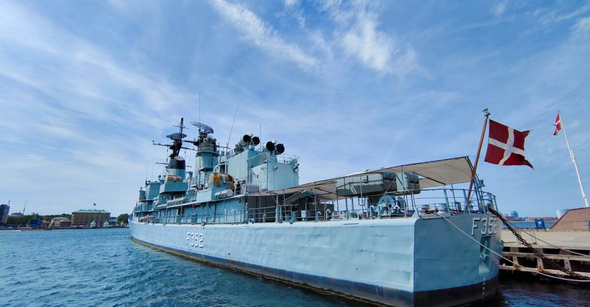 a large battleship sitting in the middle of a body of water