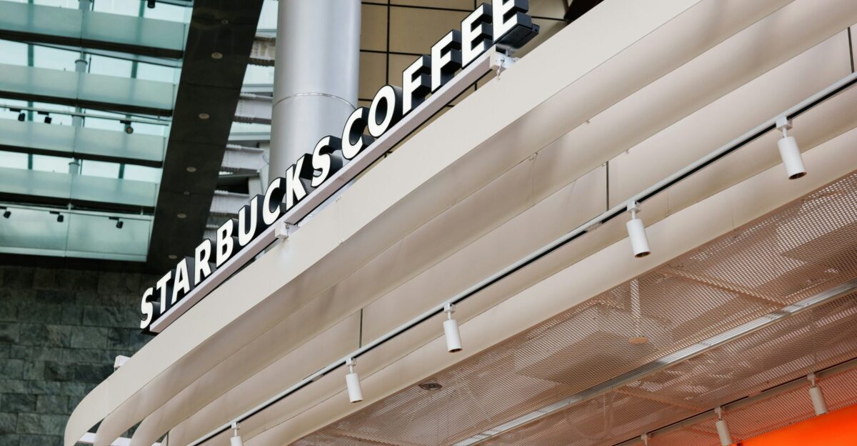 a starbucks sign on the side of a building