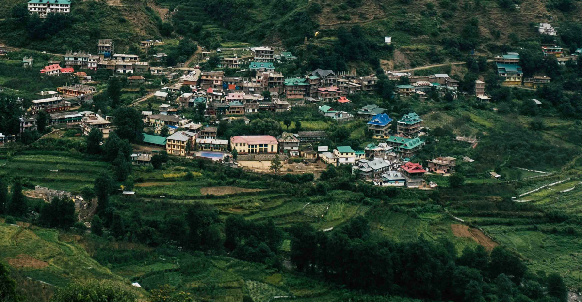 a small village nestled in a valley surrounded by mountains