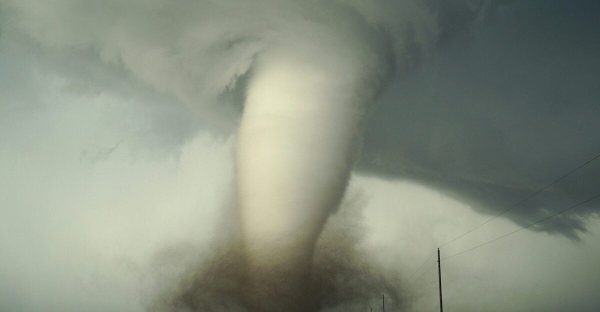 a large tornado is coming down the road