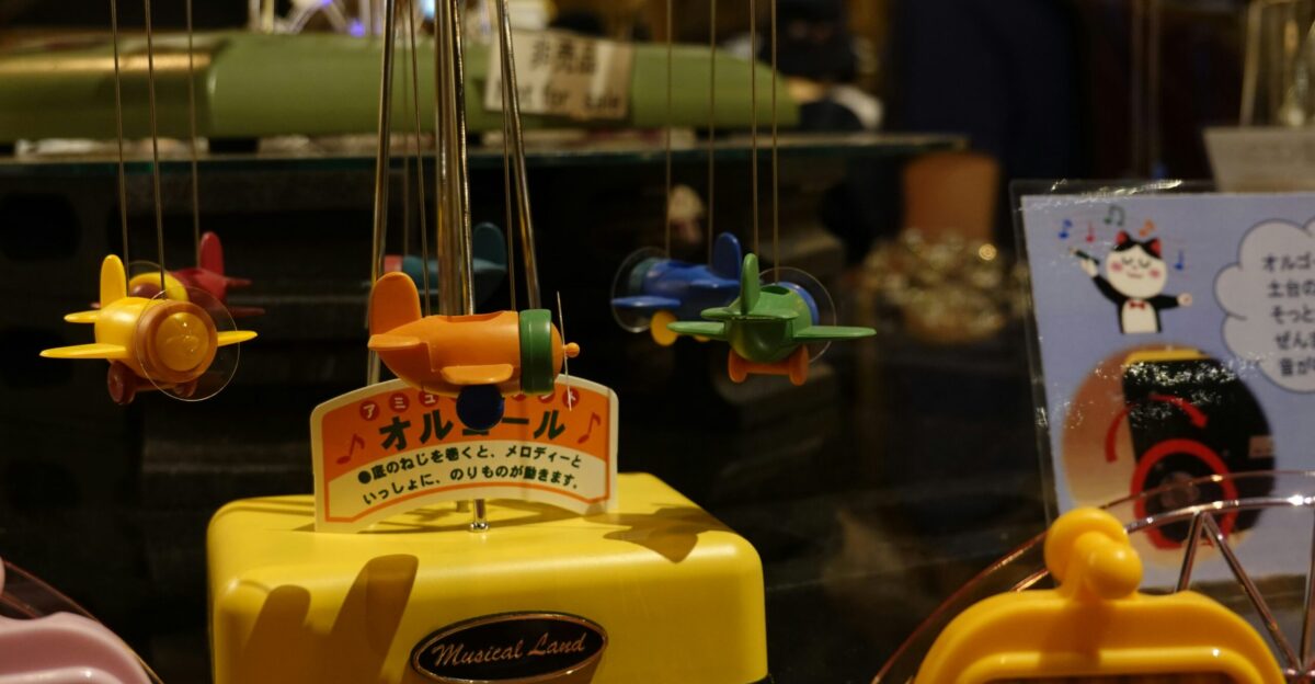 a group of toy airplanes hanging from strings