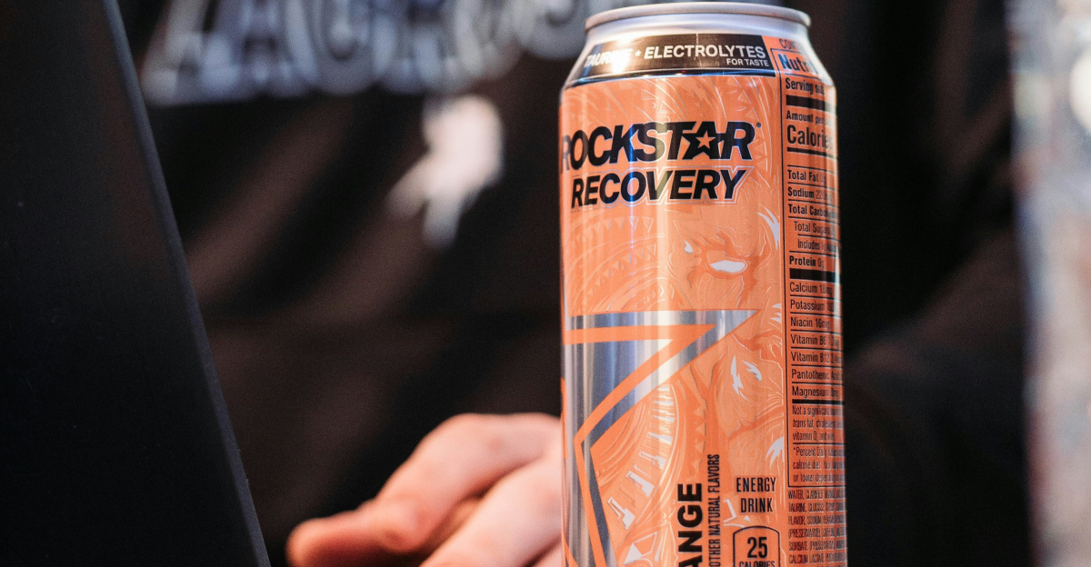 a man sitting in front of a laptop computer