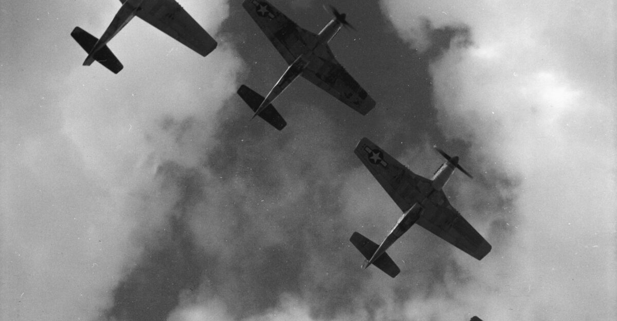 Four P-51 Mustangs flying in formation