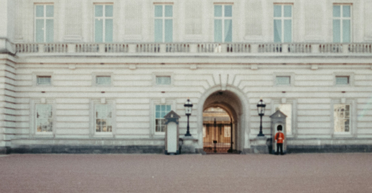 a large white building with a clock on the front of it