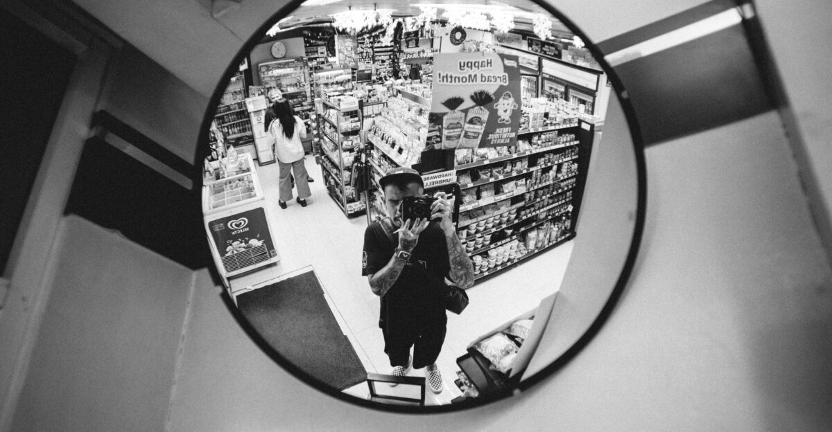 a person standing in front of a mirror in a store