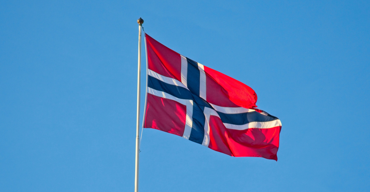 a flag flying on top of a building