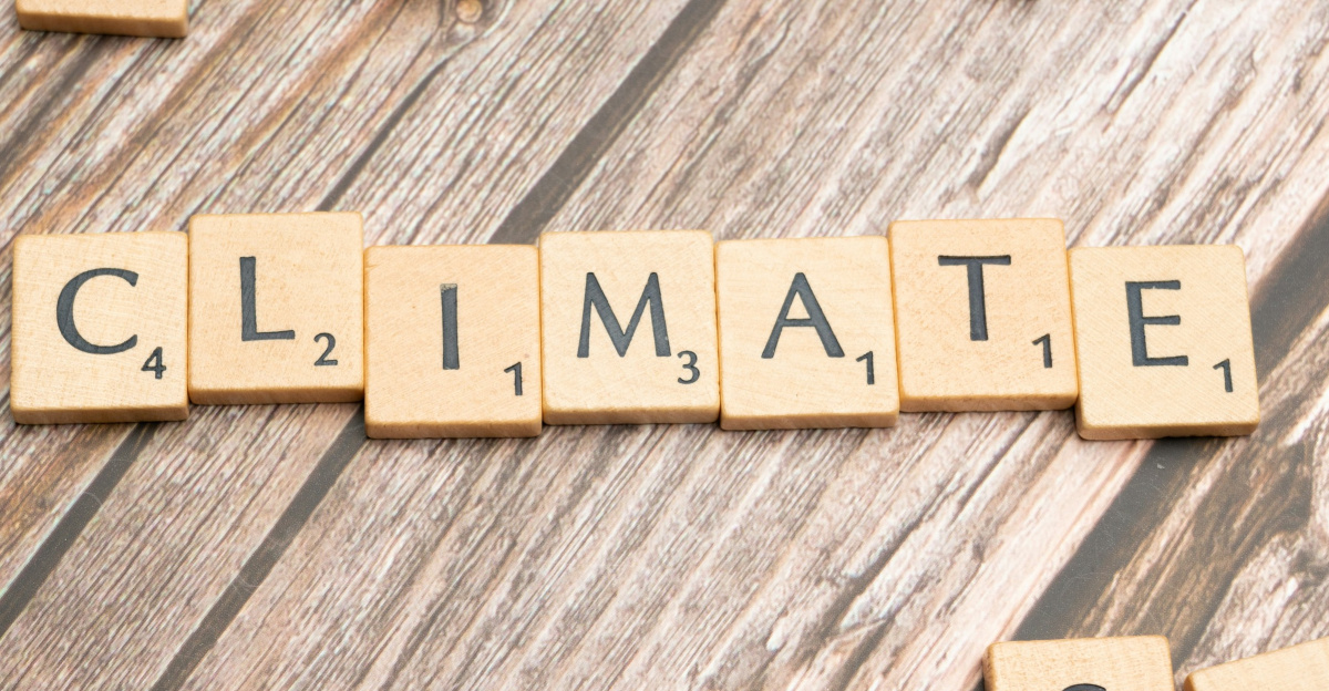 scrabble tiles spelling climate on a wooden surface