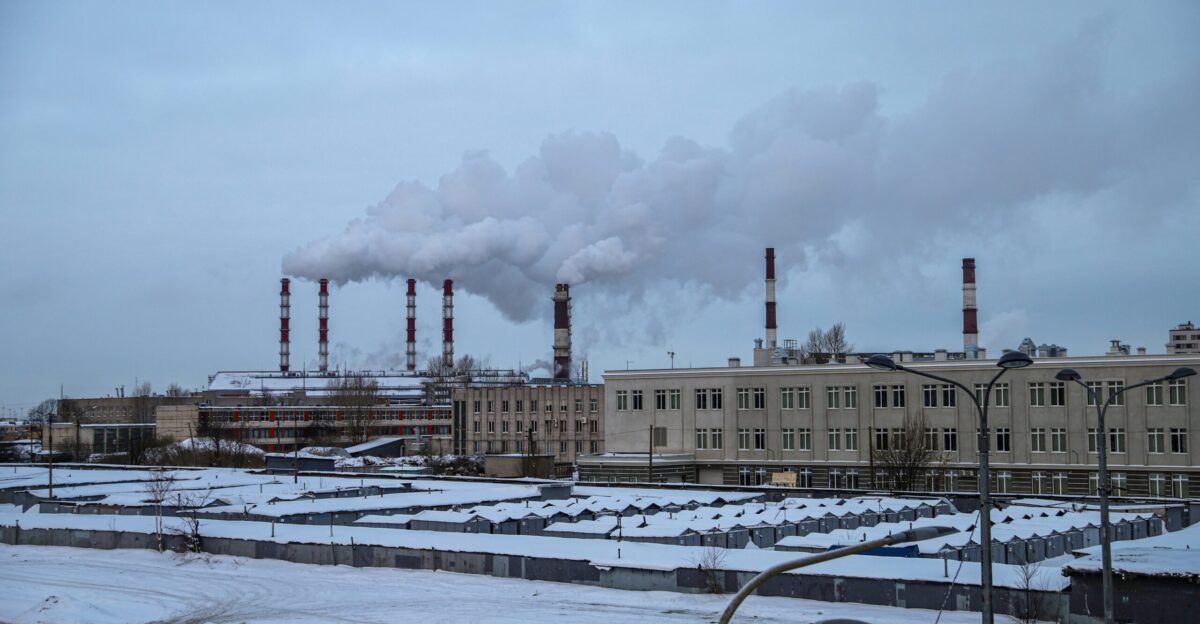 a factory with a lot of smoke coming out of it