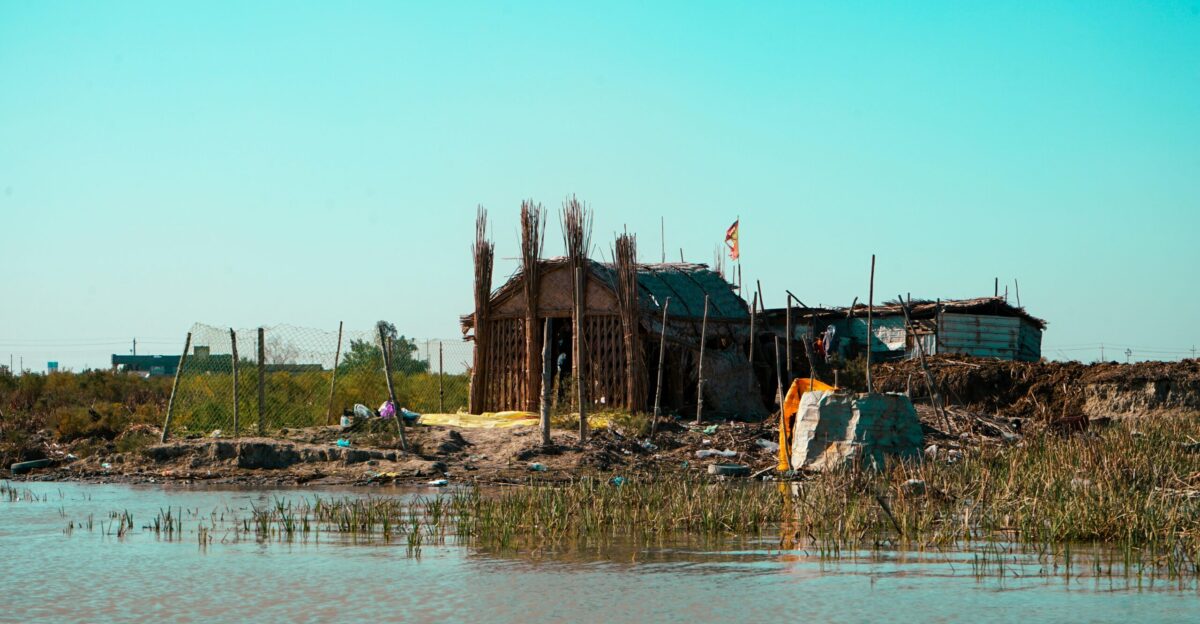 a house on the shore of a body of water