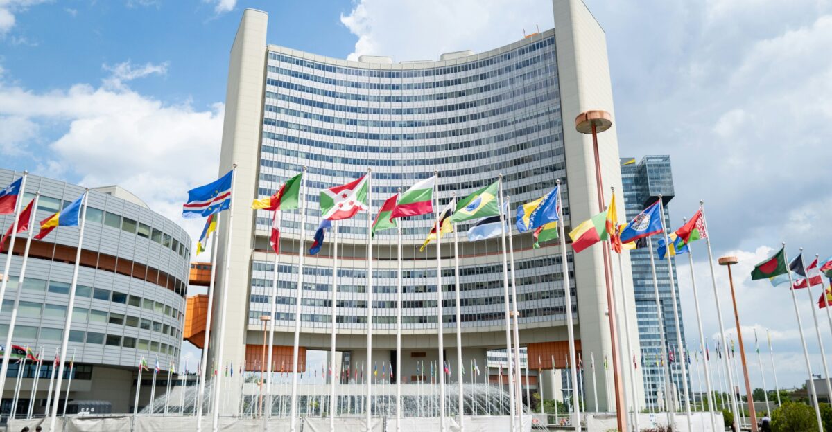 a large building with a lot of flags in front of it
