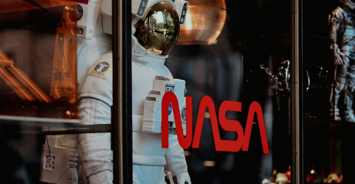 an astronaut suit is displayed in a window