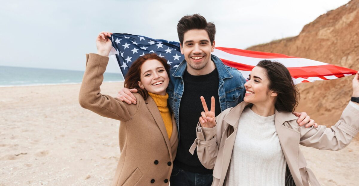 a couple of people that are standing in the sand