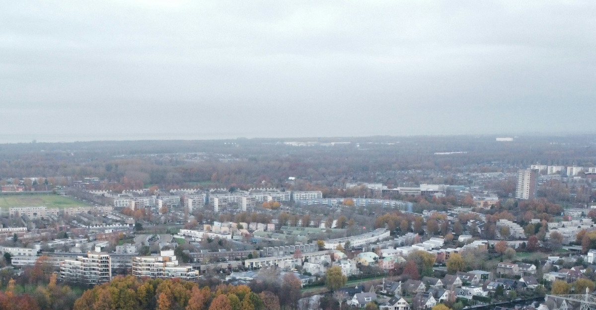 an aerial view of a city and a lake