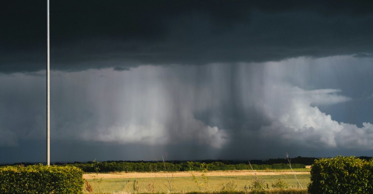 A storm moving across the sky over a road