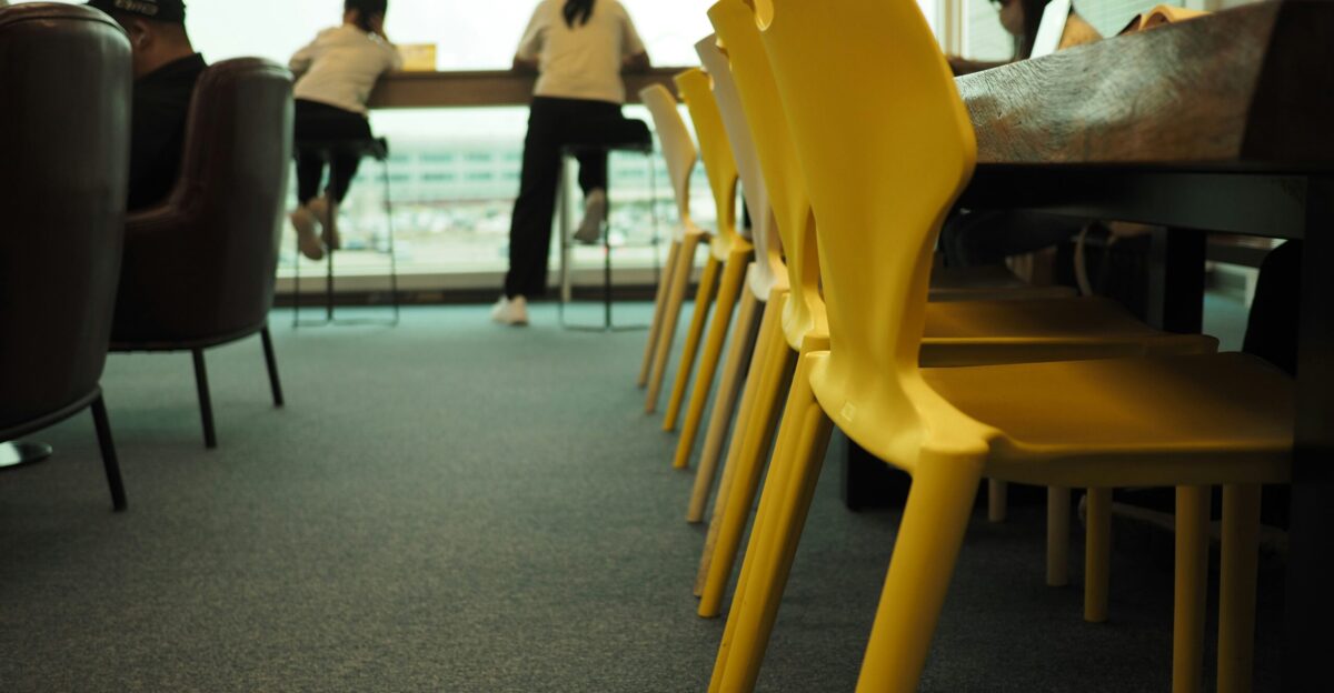 A group of people sitting at a table in a room