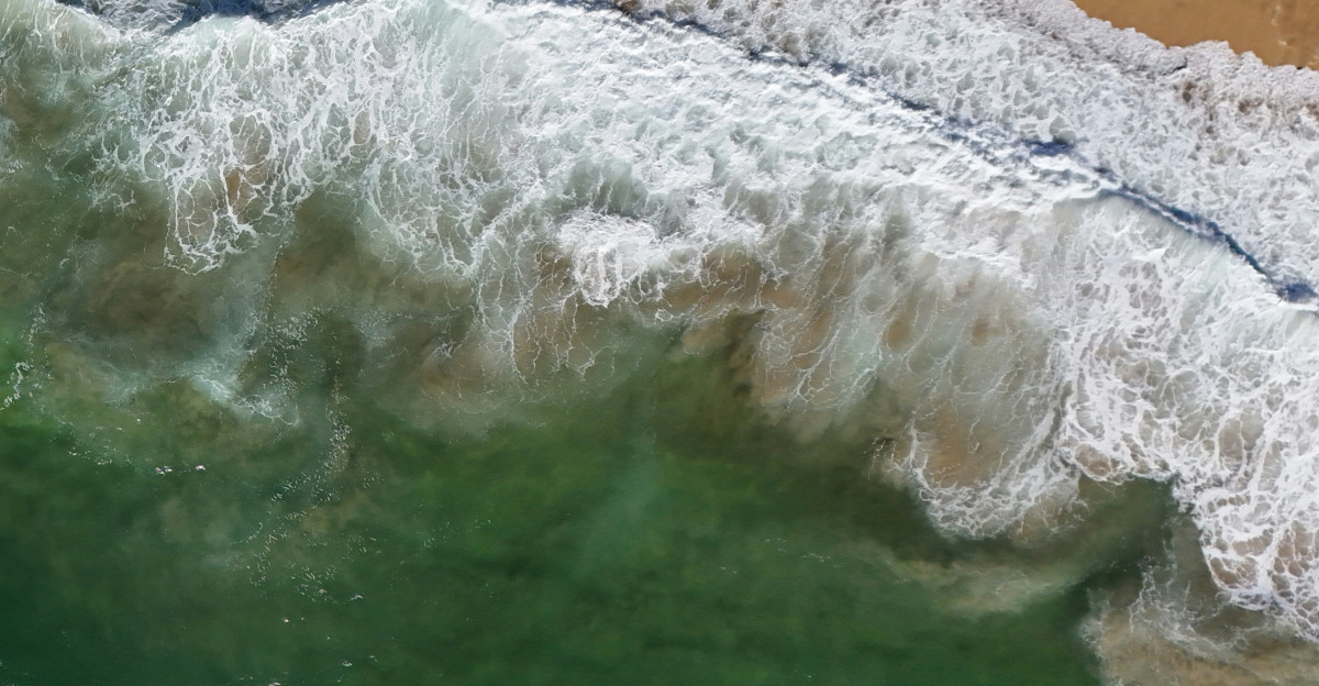 An aerial view of a beach and ocean