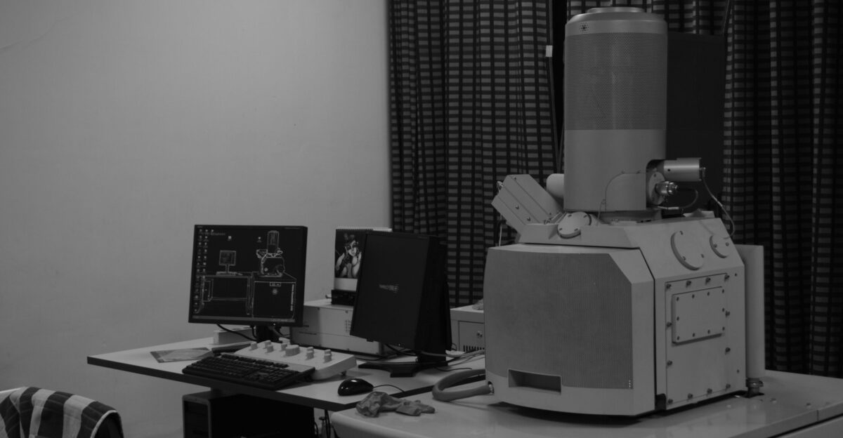 A black and white photo of a computer desk