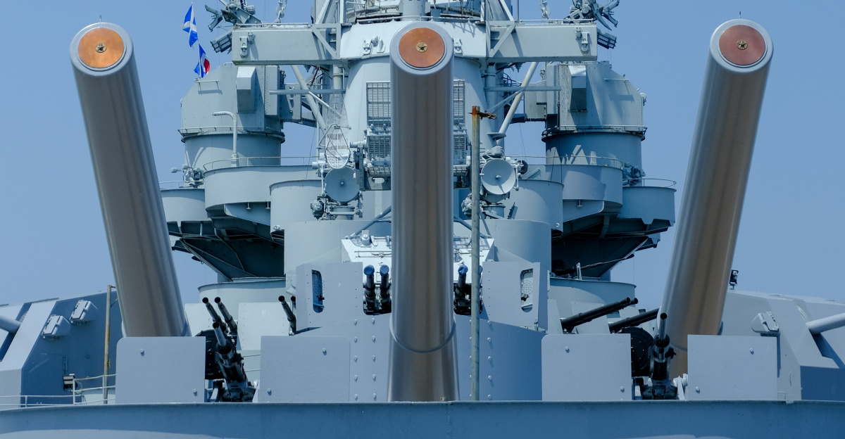 A large blue ship in the middle of a body of water