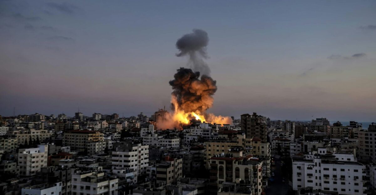 A large fire is burning in a city