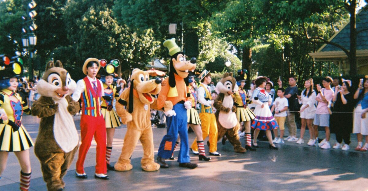 A group of people in costume standing on a street