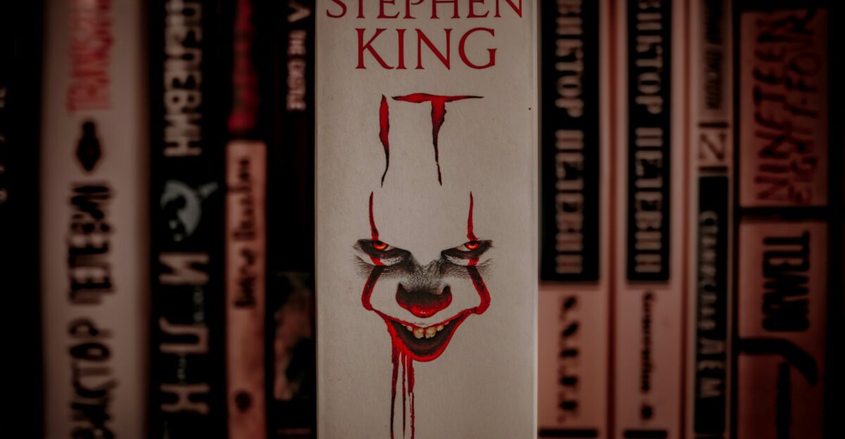 A book with a creepy clown face on it