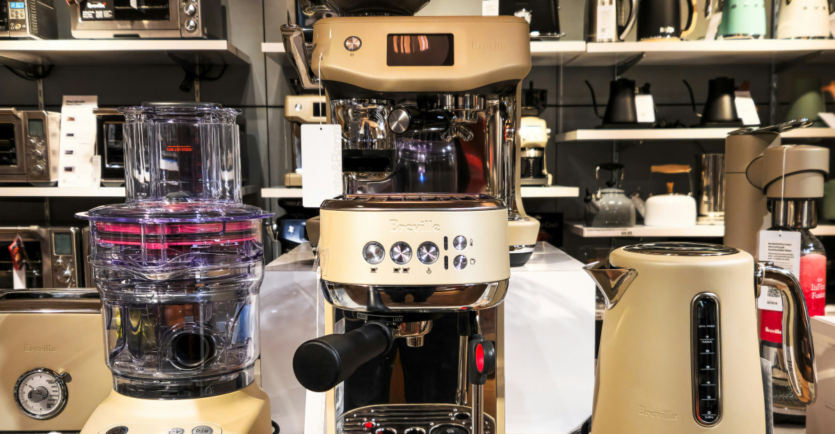 A counter top with a blender and other appliances on it