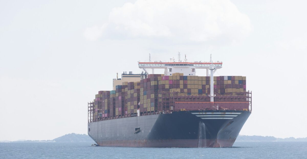 A cargo ship travels across the ocean