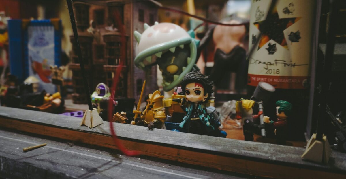 Many tiny figurines displayed in a window