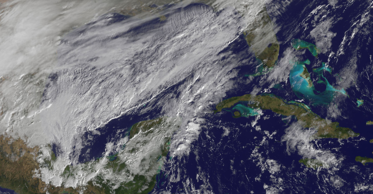 The Polar Vortex is a whirling and persistent large area of low pressure found typically over both north and south poles The northern Polar Vortex is pushing southward over western Wisconsin eastern Minnesota today Monday January 6 2014 and is bringing frigid temperatures to half of the continental United States It is expected to move northward back over Canada toward the end of the week This image was captured by NOAA s GOES-East satellite on January 6 2014 at 1601 UTC 11 01 a m EST A frontal system that brought rain to the coast is draped from north to south along the U S East Coast Behind the front lies the clearer skies bitter cold air associated with the Polar Vortex The GOES image also revealed snow on the ground in Minnesota Wisconsin Illinois Indiana Ohio Michigan Iowa and Missouri stretching into the Great Plains Cloudiness over Texas is associated with a low pressure system centered over western Oklahoma that is part of the cold front connected to the movement of the Polar Vortex The GOES image was created at NASA s GOES Project located at NASA s Goddard Space Flight Center in Greenbelt Md Both the northern and southern polar vortices are located in the middle and upper troposphere lowest level of the atmosphere and the stratosphere next level up in the atmosphere The polar vortex is a winter phenomenon It develops and strengthens in its respective hemisphere s winter as the sun sets over the polar region and temperatures cool They weaken in the summer In the northern hemisphere they circulate in a counter-clockwise direction so the vortex sitting over western Wisconsin is sweeping in cold Arctic air around it The Arctic Polar Vortex peaks in the Northern Hemisphere s wintertime and has already moved southward several times this winter In the past it has also moved southward over Europe On January 21 1985 the National Oceanic and Atmospheric Administration Daily Weather Map series showed a strong polar vortex centered over Maine The Polar Vortex also affects ozone For more information on the Polar Vortex and how it affects ozone visit NASA s Ozone Watch page ozonewatch gsfc nasa gov facts vortex NH html Rob Gutro NASA s Goddard Space Flight Center Credit NOAA NASA GOES Project NASA image use policy NASA Goddard Space Flight Center enables NASA s mission through four scientific endeavors Earth Science Heliophysics Solar System Exploration and Astrophysics Goddard plays a leading role in NASA s accomplishments by contributing compelling scientific knowledge to advance the Agency s mission Follow us on Twitter Like us on Facebook Find us on Instagram