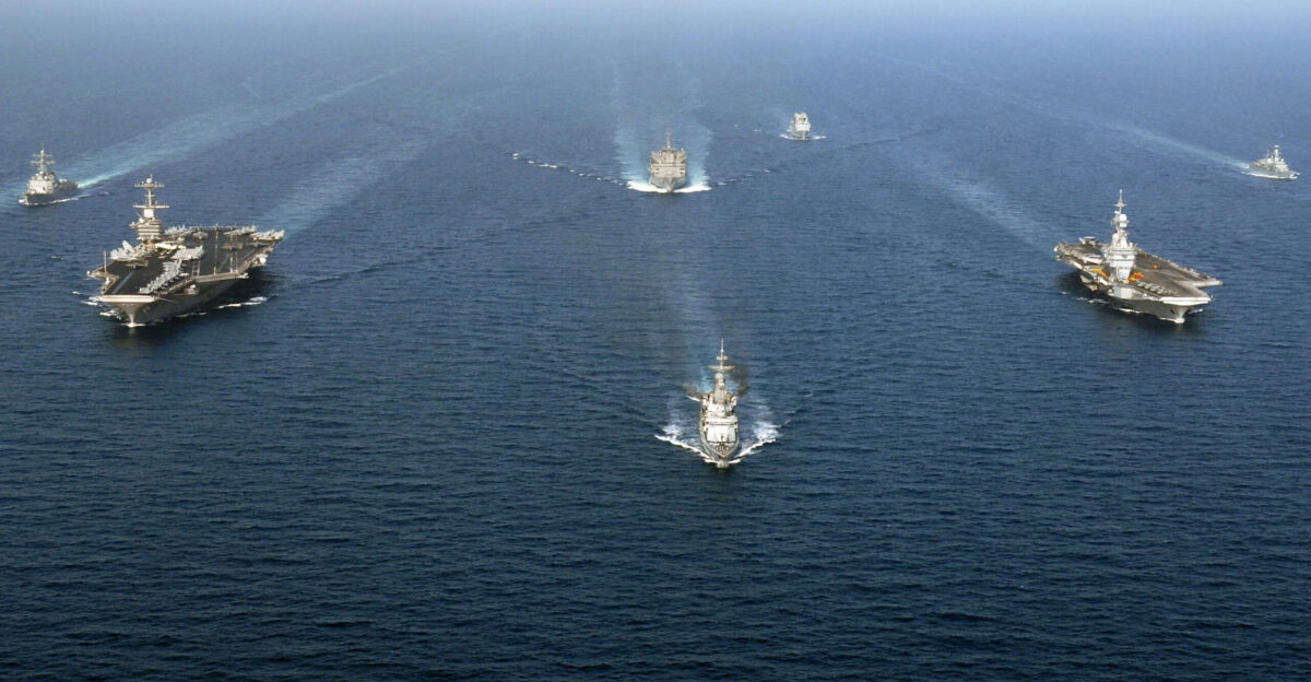 ARABIAN SEA March 25 2007 - American French and British ships operating with John C Stennis Carrier Strike Group and Combined Task Force 473 steam together during a photo exercise The strike group and task force have been operating in the Arabian Sea in support of Maritime Security Operations MSO MSO help set the conditions for security and stability as well as aid counter-terrorism and security efforts to the regional nations U S Navy photo by Mass Communication Specialist 3rd Class Ron Reeves RELEASED