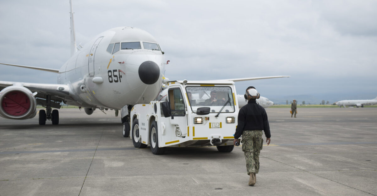 N-CR843-0071 SIGONELLA Italy April 04 2020 Aviation Machinists Mate Airman Rushanieuq Patterson from Fort Lauderdale Florida and assigned to Patrol Squadron VP 4 directs a plane a P-8A Poseidon aircraft towards the wash rack onboard Naval Air Station Sigonella VP-4 is currently forward deployed to the U S 6th Fleet area of operations and is assigned to Commander Task Force 67 responsible for tactical control of deployed maritime patrol and reconnaissance squadrons throughout Europe and Africa U S Navy photo by Mass Communication Specialist 2nd Class Juan Sua
