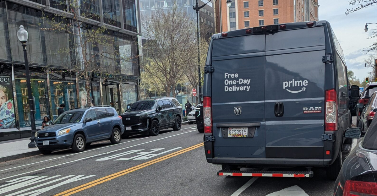 An Amazon Prime RAM ProMaster van illegally parked in a bike lane at CityCenterDC during a delivery.