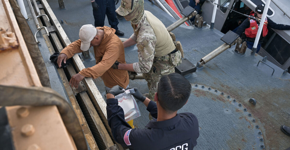 Petty Officer 2nd Class Thomas Bender a maritime enforcement specialist aboard the U S Coast Guard Cutter Kimball WMSL 756 searches suspected drug smugglers after the crew interdicted a vessel suspected of drug smuggling in the Eastern Pacific Ocean March 3 2025 The U S Coast Guard is increasing its presence in key areas to secure the U S maritime border against the flow of cocaine fentanyl and other illegal drugs U S Coast Guard photo by Petty Officer 3rd Class Austin Wiley