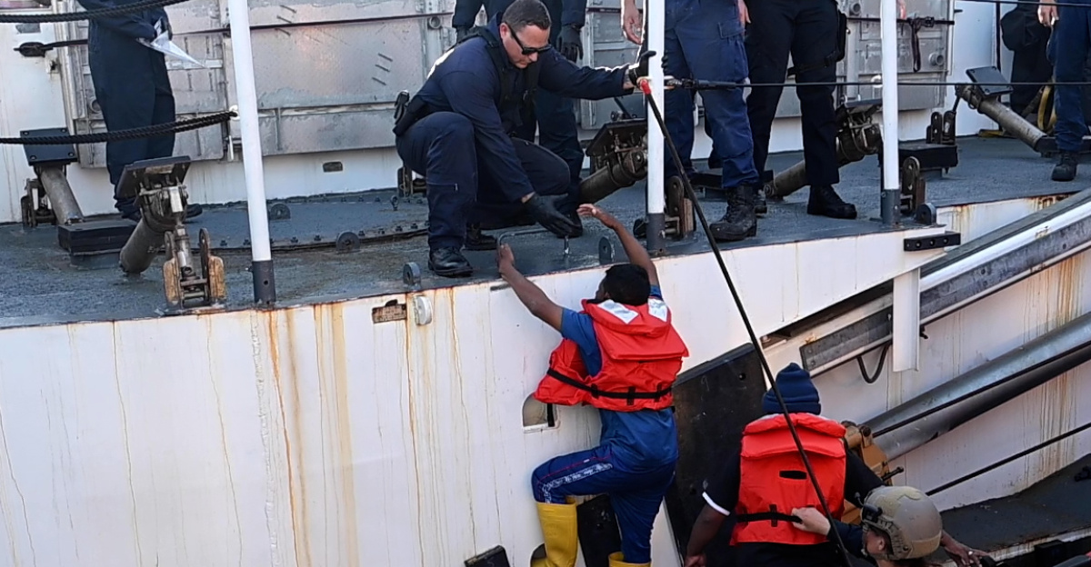 Two suspected drug smugglers are brought aboard the U.S. Coast Guard Cutter Kimball (WMSL 756) after their vessel was interdicted by Kimball’s crew while patrolling the Eastern Pacific Ocean, March 4, 2025. The U.S. Coast Guard is increasing its presence in key areas to secure the U.S. maritime border against the flow of cocaine, fentanyl, and other illegal drugs. (U.S. Coast Guard photo by Petty Officer 3rd Class Austin Wiley)