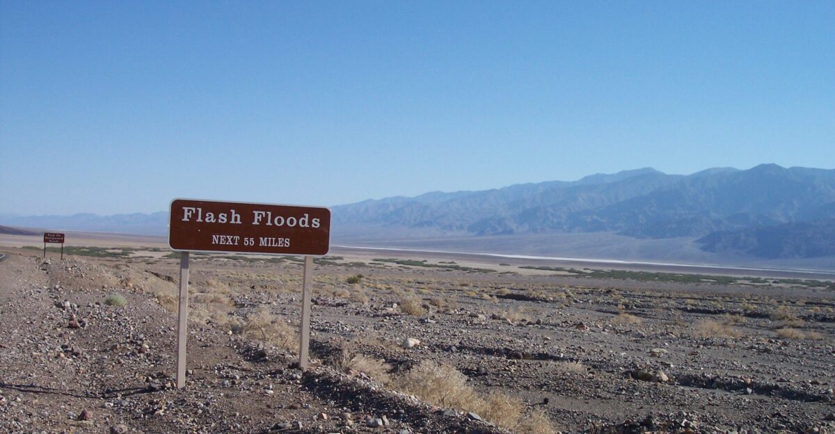 Death Valley National Park National Park Service sign warns of flash floods over a vast area