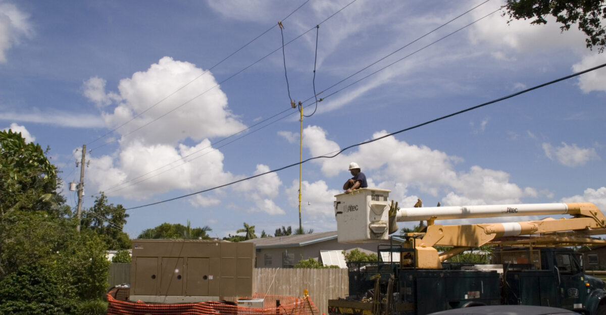 Hollywood Fla August 27 2005 - Hurricane Winds from Katrina blew utility lines down which Sumpter power crews repairing Generator in lower right is providing power for the lift pump Flood Control MARVIN NAUMAN FEMA photo