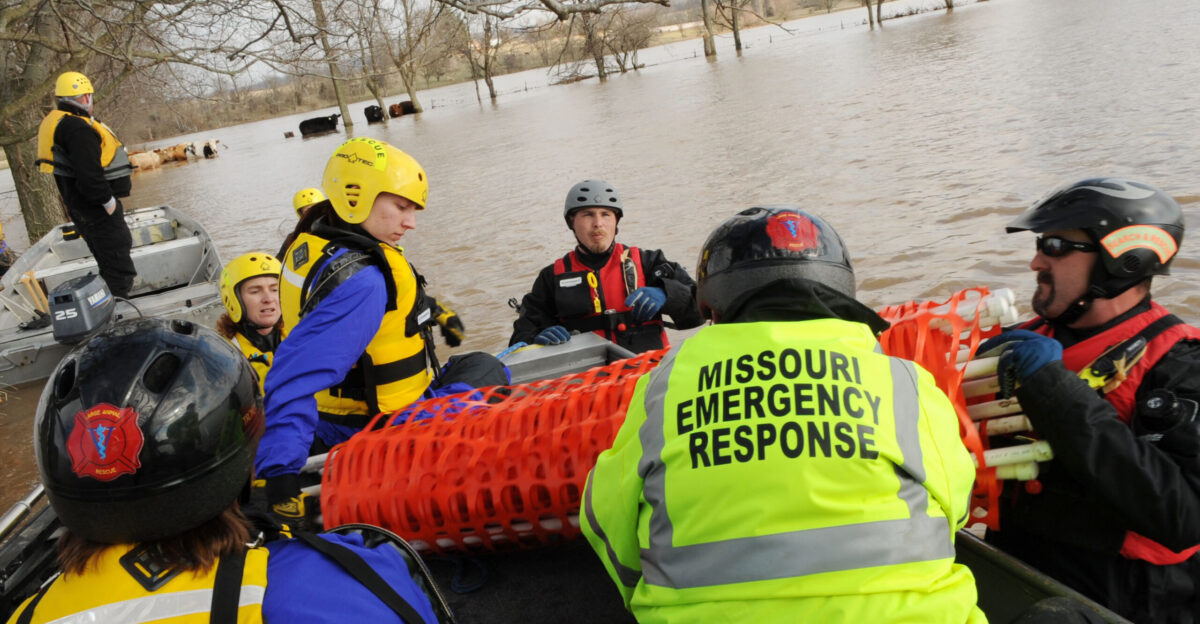 Eureka MO 03 22 2008 - Members of the Missouri Emergency Response Service team a non-profit that does large animal rescues along with the Humane Society discuss the plan to rescue 13 cattle bg that are stuck in flood waters Jocelyn Augustino FEMA