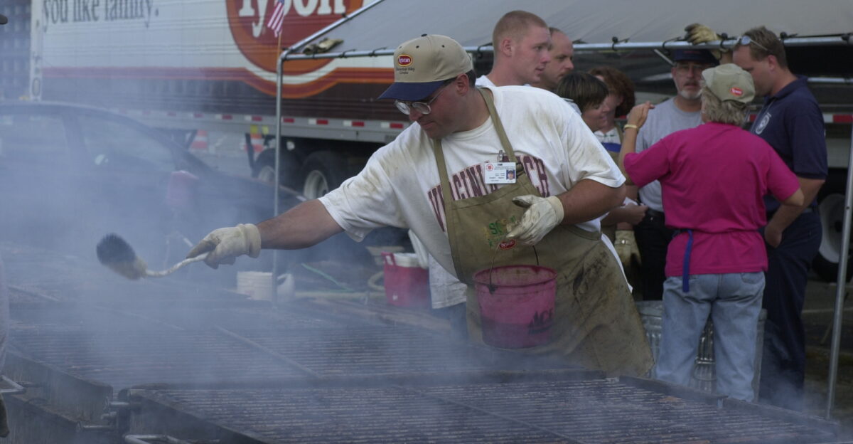 Arlington VA September 19 2001 - Douglas Hughes a volunteer worker from Tyson Foods with the Salvation Army prepares a grill to cook food for rescue workers at the Pentagon crash site Photo by Jocelyn Augustino FEMA News Photo