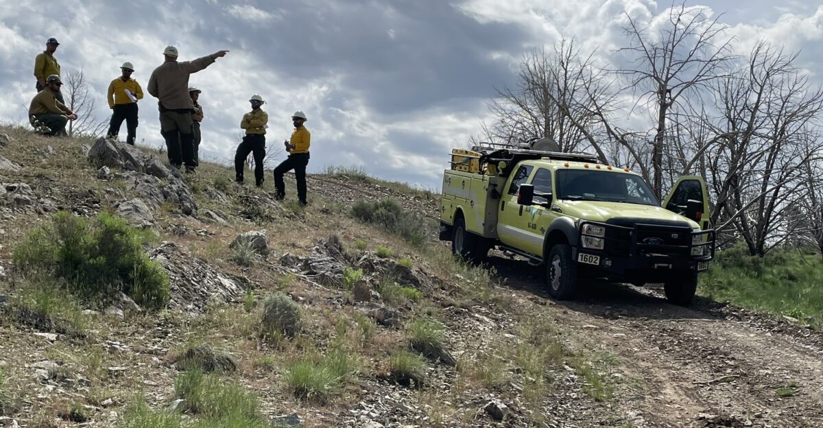 In partnership with the Unified Fire Authority and Utah National Guard firefighters attended the interagency fire engine operator training workshop on Thursday May 25 Since 2012 this annual fire engine training has been hosted at Camp Williams in Bluffdale Utah Camp Williams is the ideal location for hands-on training that accurately represents the topography terrain and vegetation present across public lands in the lower elevations of the western United States Fire engines are the backbone of initial attack fire suppression and fire training is vital to the safety and success of firefighters This specialized training program is an intensive week-long course designed to enhance the knowledge skills and abilities of firefighters with approximately three to four years of wildfire experience and features scenarios with real-world situations to use best practices for engine operations Crews learned suppression tactics polished readiness skills change a flat tire mobile attack and laying hose lines Members of the media were also invited on a field tour to learn more about the training program and conducted interviews with BLM Incident Commander Tommy Braun and Unified Fire Authority Lead Paul Story Photo Credit Javonne Goodman Public Affairs Specialist
