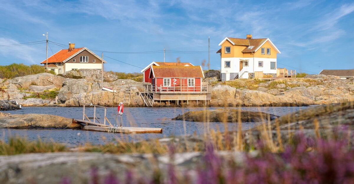 coast beach house beach house holiday home woodhouse sweden house water sea lake heaven clouds rock nature stony outlook landscape