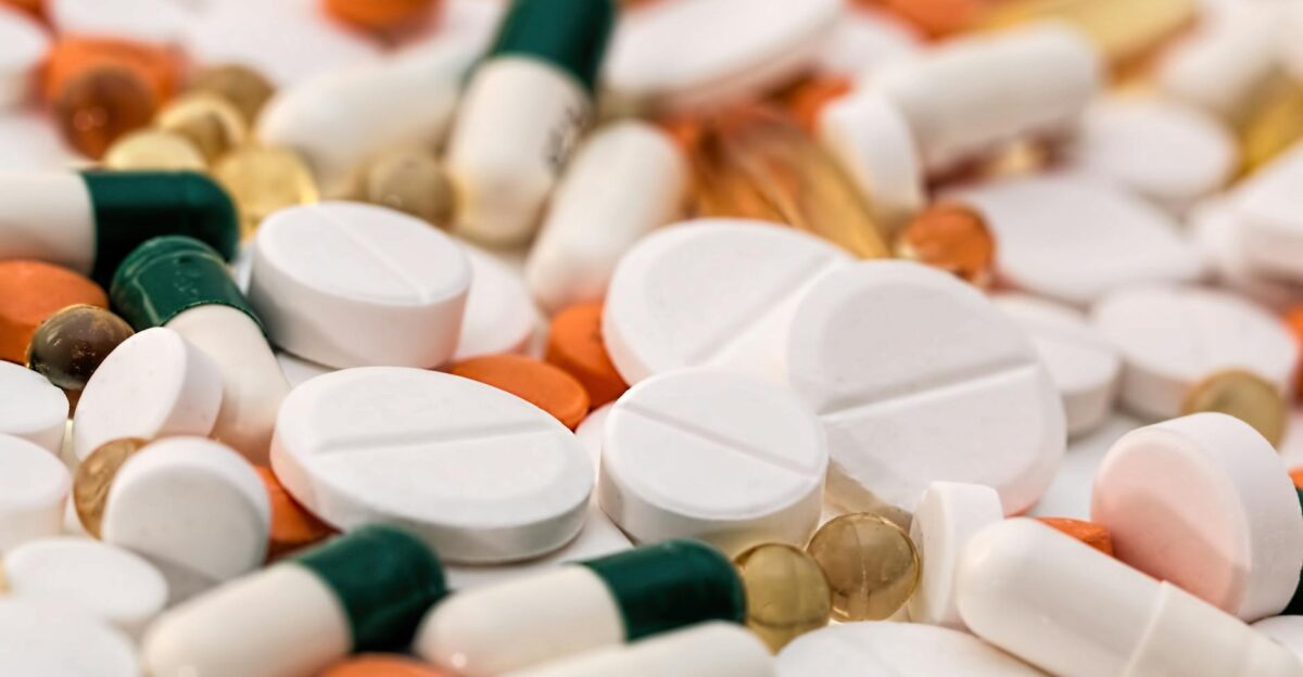 Close-up of various pills and capsules in different colors and sizes ideal for healthcare-related content