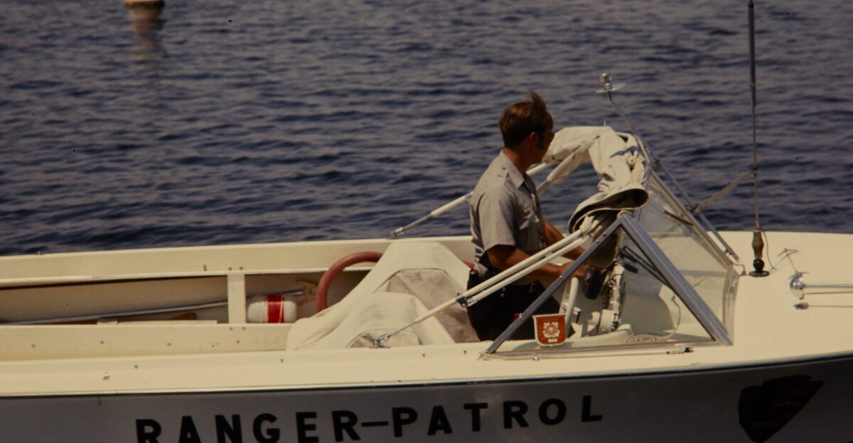 NPS Staff riding in a Ranger Patrol Boat on Lake Mead National Recreation Area Keywords boat nps staff lake search and rescue NPS Personnel NPS History Collection Themes NPS Law Enforcement Activites NPS History Collection Themes Flora NPS History Collection Themes Transportation NPS History Collection Themes