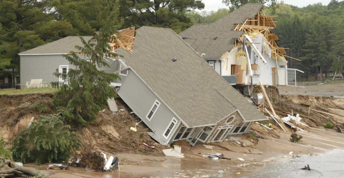Heavy rains in the Midwest caused a 245-acre lake in the town of Lake Delton Wis to overflow June 9 2008 destroying several homes as it breached a local highway and completely drained into the nearby Wisconsin River Serious flooding throughout the State of Wisconsin prompted the governor to declare a state of emergency allowing Wisconsin s Adjutant General U S Air Force Brig Gen Don Dunbar to activate National Guard troops to assist in the relief effort U S Air Force photo by Master Sgt Paul Gorman Released