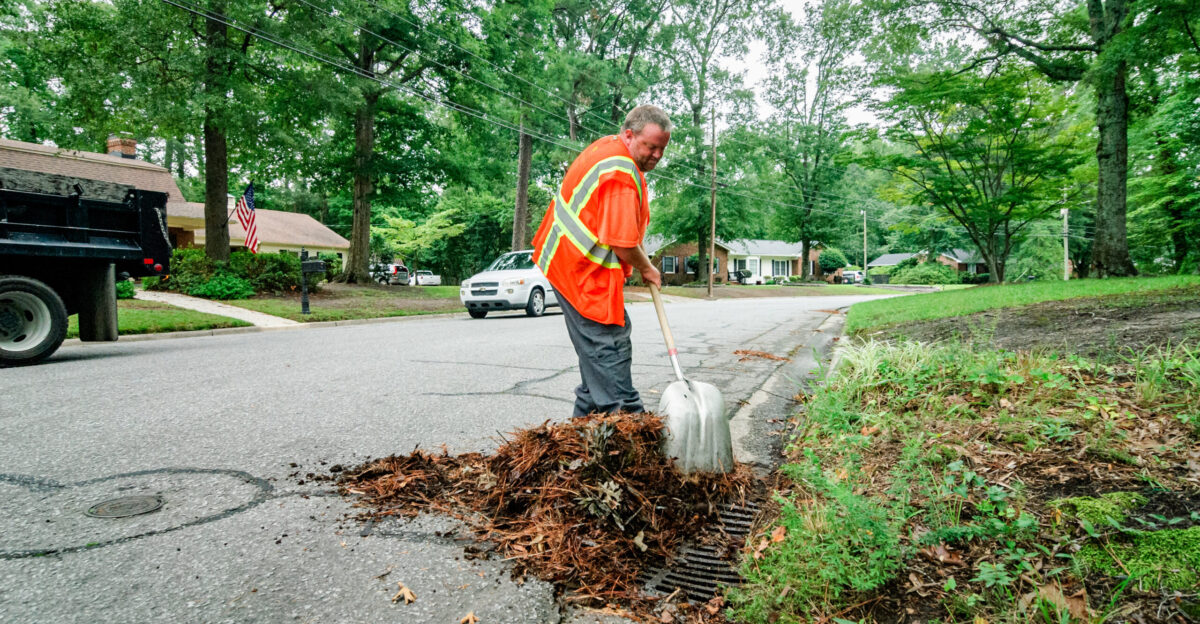 Public Works crews prepare for potential severe weather from Hurricane Idalia by cleaning debris from catch basins clearing stormwater runoff channels removing debris from curbs and trimming tree limbs in danger of falling on Wednesday August 30 2023