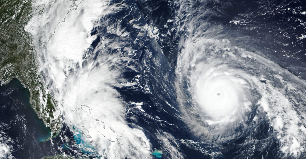 A pair of tropical cyclones Imelda and Humberto churned through the Atlantic Basin in late September 2025 Although both storms were forecast to stay over the ocean they still sent heavy rain gusty winds and dangerous surf to the northern Caribbean the Bahamas Bermuda and the U S East Coast Tropical Storm Imelda and Hurricane Humberto appear together in this image acquired with the VIIRS Visible Infrared Imaging Radiometer Suite on the Suomi NPP satellite on September 28 That afternoon Imelda was moving northward through the Bahamas with sustained winds of 40 miles 64 kilometers per hour Meanwhile Humberto was approximately 700 miles 1 100 kilometers east of the Bahamas and moving northwest Its maximum sustained winds were 150 miles 240 kilometers per hour at the time making it a Category 4 storm The previous day Humberto reached Category 5 strength-the second Atlantic hurricane to do so this season Imelda had already brought tropical storm conditions to portions of the central and northwestern Bahamas Prior to becoming a named storm the system also lashed Puerto Rico and eastern Cuba with heavy rain In the coming days Imelda could intensify and cause flash and urban flooding along the coast of the Carolinas according to the National Hurricane Center Although Humberto lurked farther from land its effects still reached coastlines due to its massive size Dangerous surf conditions affected beaches in the northern Caribbean the Bahamas and Bermuda as well as much of the U S East Coast Mid-Atlantic and even some Northeast states could see large swells and rip currents stemming from the storm forecasters warned Conditions along the U S Atlantic Coast particularly from Imelda may be less severe than previously expected however That s because Humberto being relatively close by could influence Imelda s track and draw it away from shore This sort of interaction between neighboring tropical cyclones is a rare phenomenon known as the Fujiwhara Effect The storms potential tug-of-war presents forecasting challenges but as of the morning of September 29 Imelda was projected to take an abrupt turn to the east-northeast No Atlantic hurricanes have made landfall thus far in 2025 NASA Earth Observatory image by Lauren Dauphin using VIIRS data from NASA EOSDIS LANCE GIBS Worldview and the Suomi National Polar-orbiting Partnership Story by Lindsey Doermann
