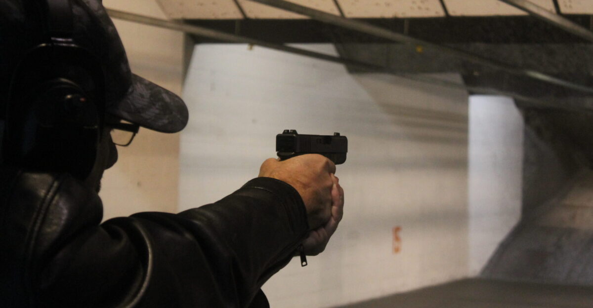 A man aiming a Glock 30 at American Shooters Las Vegas Nevada