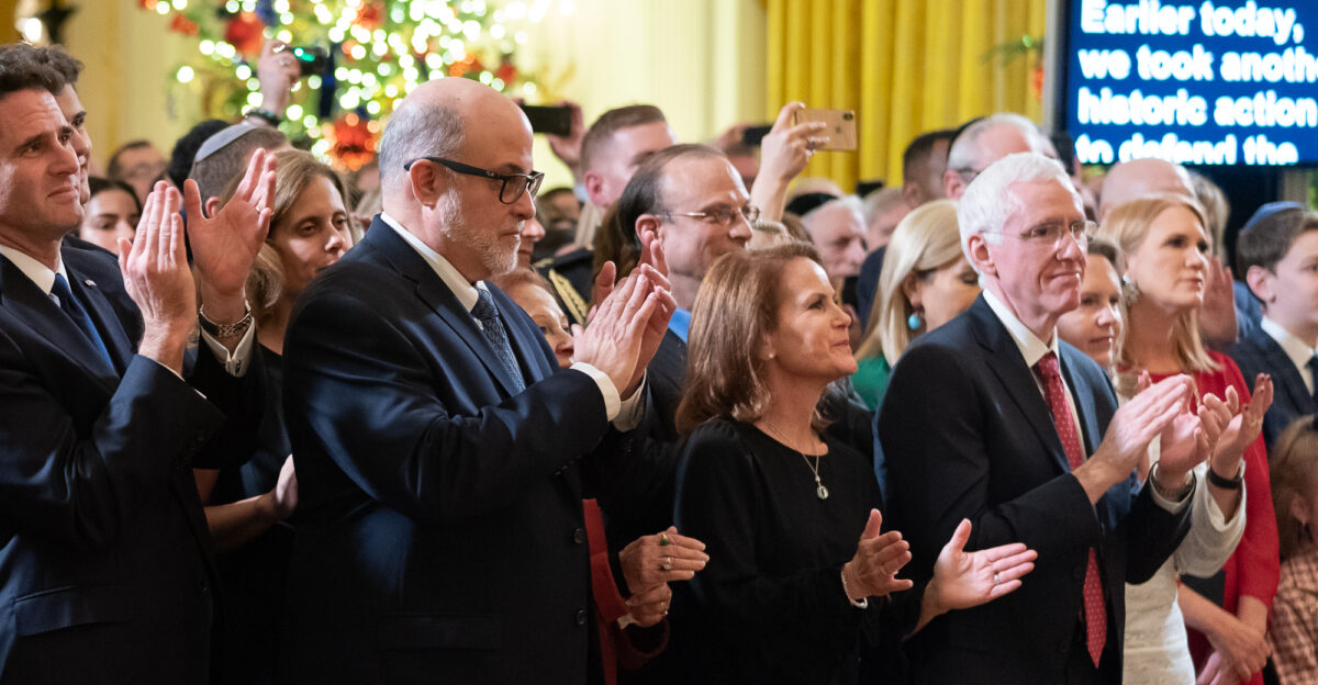 Original caption President Donald J Trump is applauded during his remarks Wednesday Dec 11 2019 during an evening Hanukkah Reception in the East Room of the White House Among those on the front row are from the farthest left Israeli Ambassador to the U S Ron Dermer and American talk radio host Mark Levin