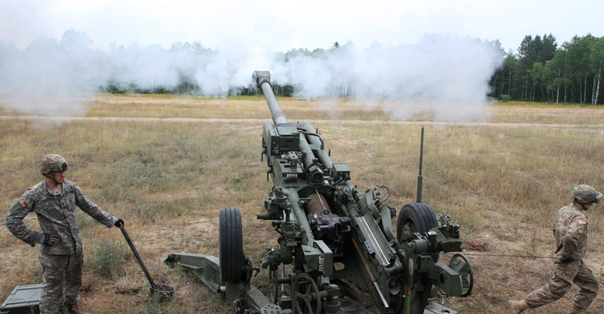 Michigan ANG soldiers fire a 155 mm M777 Howitzer at the Camp Grayling Joint Maneuver Training Center during Exercise Northern Strike 2016