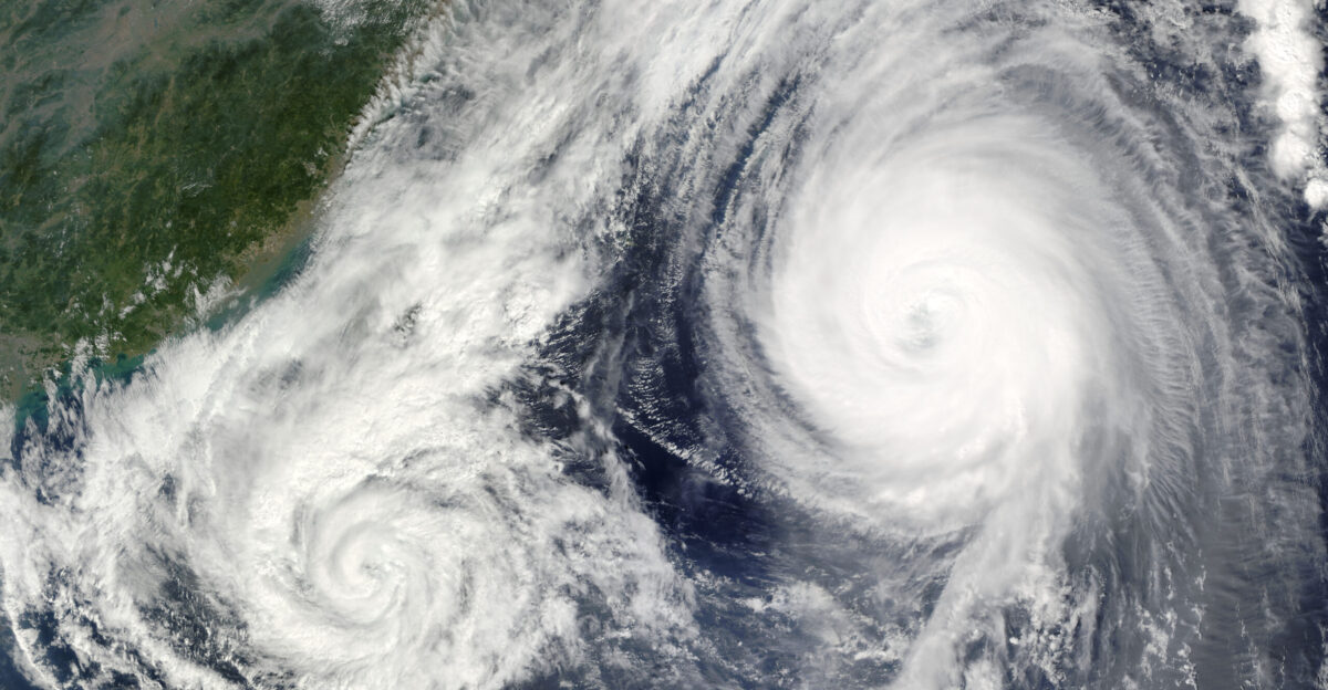 Once a powerful Super Typhoon Parma crossed over the northern tip of Luzon Island the Philippines on October 3 2009 as a Category 1 typhoon The storm battered the island with damaging winds and heavy rain before moving over the South China Sea where it stalled spinning more or less in place for about a day and a half On October 6 the storm reversed direction and moved southeast back over Luzon What caused this change in direction The answer is shown in this true color image from October 6 The powerful Super Typhoon Melor moved close enough to Parma to influence its motion When two cyclones approach one another they can interact in a variety of ways One interaction is the Fujiwara Effect in which the two storms are drawn together and begin to circle around each other In this case Parma was drawn towards the stronger Melor Occasionally the stronger storm will absorb the weaker storm but that fate wasn t in the forecast for Parma as of October 6 The Joint Typhoon Warning Center expected Parma to move south away from Melor and eventually track west over the South China Sea on October 8 This image blends two satellite overpasses to show the proximity of the two storms to one another The left half of the image containing Tropical Storm Parma is from the Moderate Resolution Imaging Spectroradiometer MODIS on NASA s Terra satellite acquired at 10 35 a m Philippine time The right half of the image was taken just under two hours later Philippine time by the MODIS instrument on NASA s Aqua satellite The time difference causes the subtle differences in lighting from one side of the image to the other Parma left at least 22 people dead and damaged millions of dollars of crops and infrastructure in floods and landslides across northern Luzon as of October 6 reported Reuters The storm is likely to do more damage as it tracks slowly south over the island pouring heavy rain The Joint Typhoon Warning Center expected Melor to come ashore over Japan early on October 8 local time as a weak Category 1 typhoon At the time of these satellite overpasses Tropical Storm Parma had sustained winds of about 100 kilometers per hour 60 miles per hour or 55 knots according to the Joint Typhoon Warning Center The storm maintains a spiral shape but no longer has the tightly packed bands of clouds exhibited by the much stronger Typhoon Melor At 12 10 Philippine time Melor had sustained winds of about 200 km hr 130 mph or 115 knots making it a Category 4 typhoon 1 Mogato M 2009 October 6 Typhoon heads to Japan storm stall over Philippines Reuters published in Washington Post Accessed October 6 2009 2 Unisys Weather 2009 October 6 Super Typhoon-5 Melor Accessed October 6 2009 3 Unisys Weather 2009 October 6 Super Typhoon-4 Parma Accessed October 6 2009
